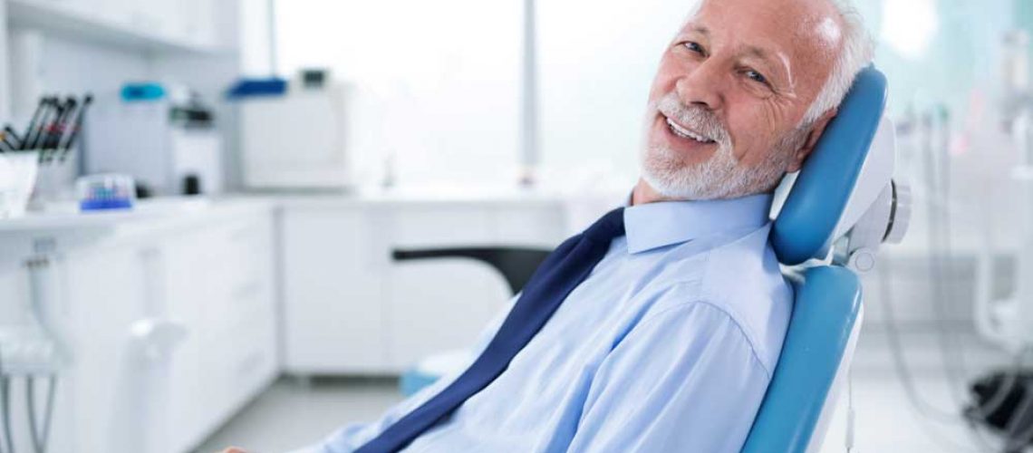 dental patient smiling after his treatment with sedation